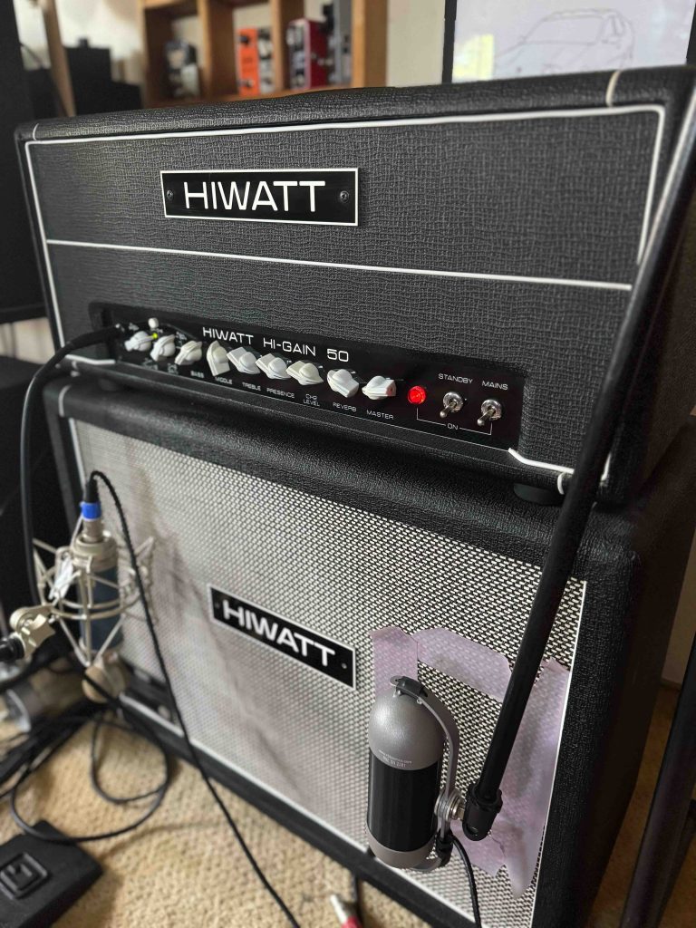 A Hiwatt Hi-Gain 50 amplifier head sitting on a Hiwatt 2 X 12 Cabinet with Fane Speakers