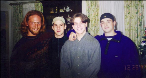 a group of guys standing together as a photo
