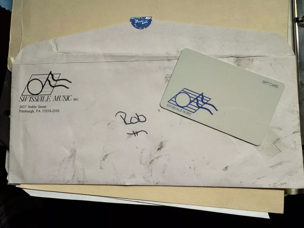 an old envelope showing a gift card from tha authors dad. 