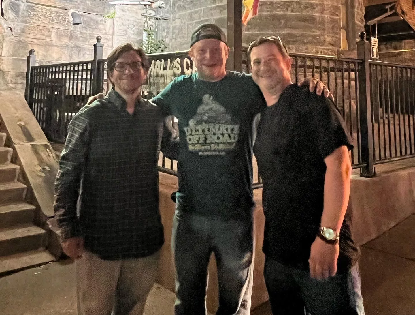 Scott, Tom, and Rob outside of Mr. Smalls in 2022