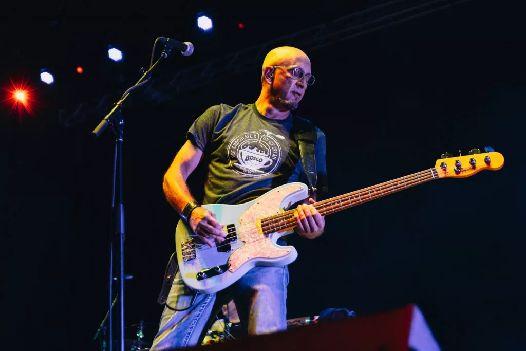 a bass player playing live at a concert